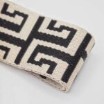 Veskestropp geometrisk mønster svart og beige